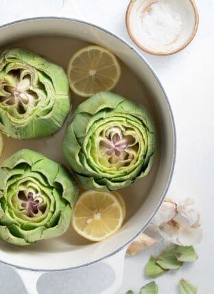 Learn How to Cook Artichokes like a pro with these easy boiled and steamed artichokes recipe.  Cooking artichokes couldn't be easier and they make a nice starter and a great side to serve with grilled chicken or fish.  