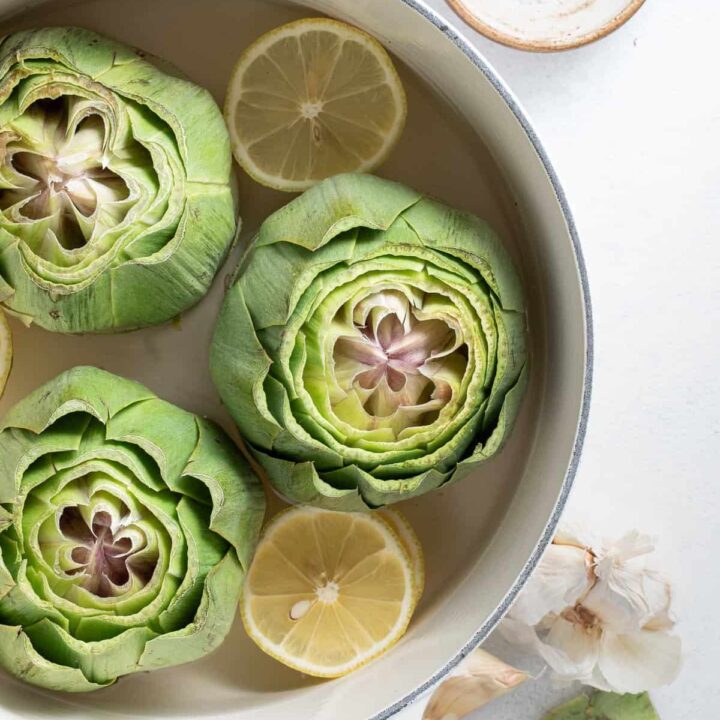 Learn How to Cook Artichokes like a pro with these easy boiled and steamed artichokes recipe.  Cooking artichokes couldn't be easier and they make a nice starter and a great side to serve with grilled chicken or fish.  