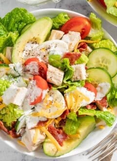 A white bowl filled with Turkey Cobb Salad.