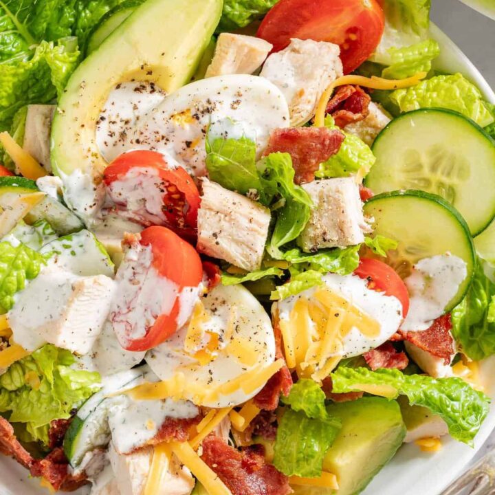 A white bowl filled with Turkey Cobb Salad.