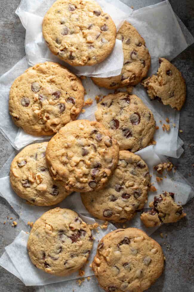 Many baked treats scattered on bakers paper.