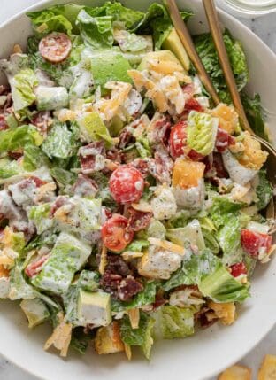 A white bowl filled with BLT salad tossed in Ranch Dressing.