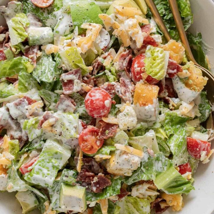 A white bowl filled with BLT salad tossed in Ranch Dressing.