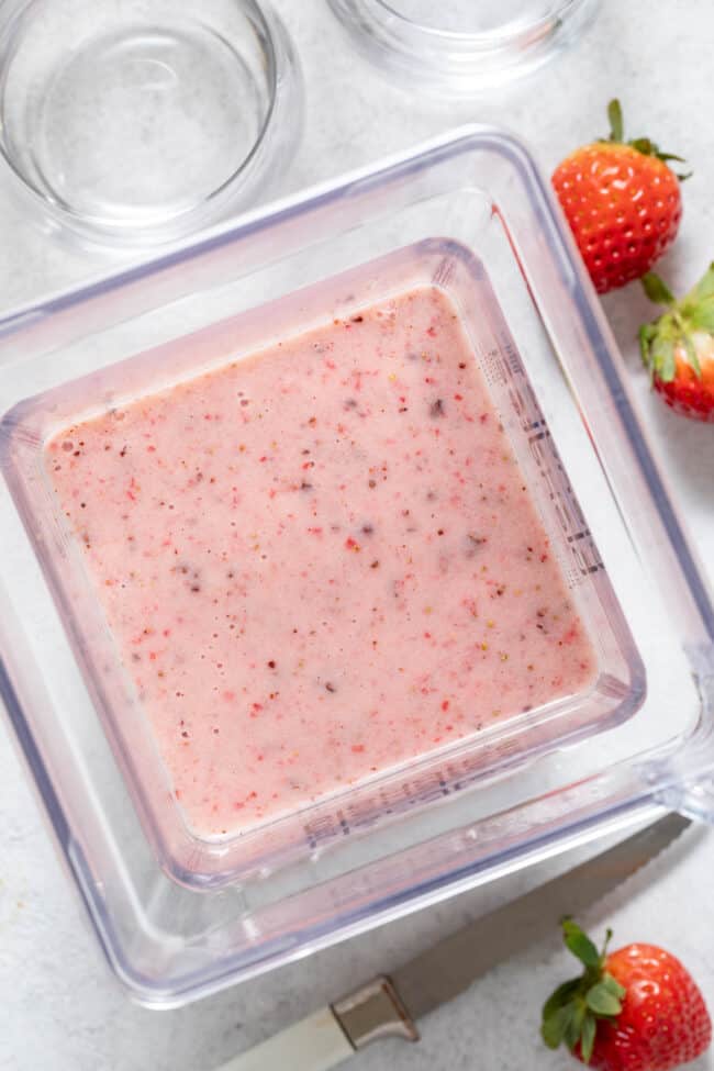 Strawberry Cacao Smoothie in a blender.