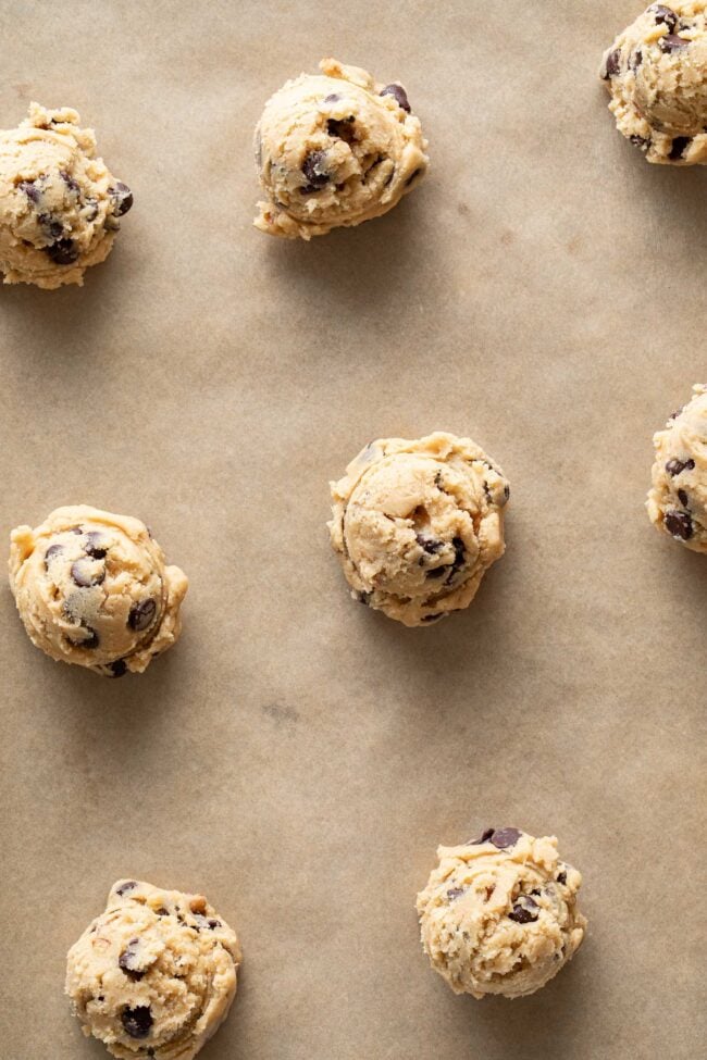 Balls of batter on parchment paper.