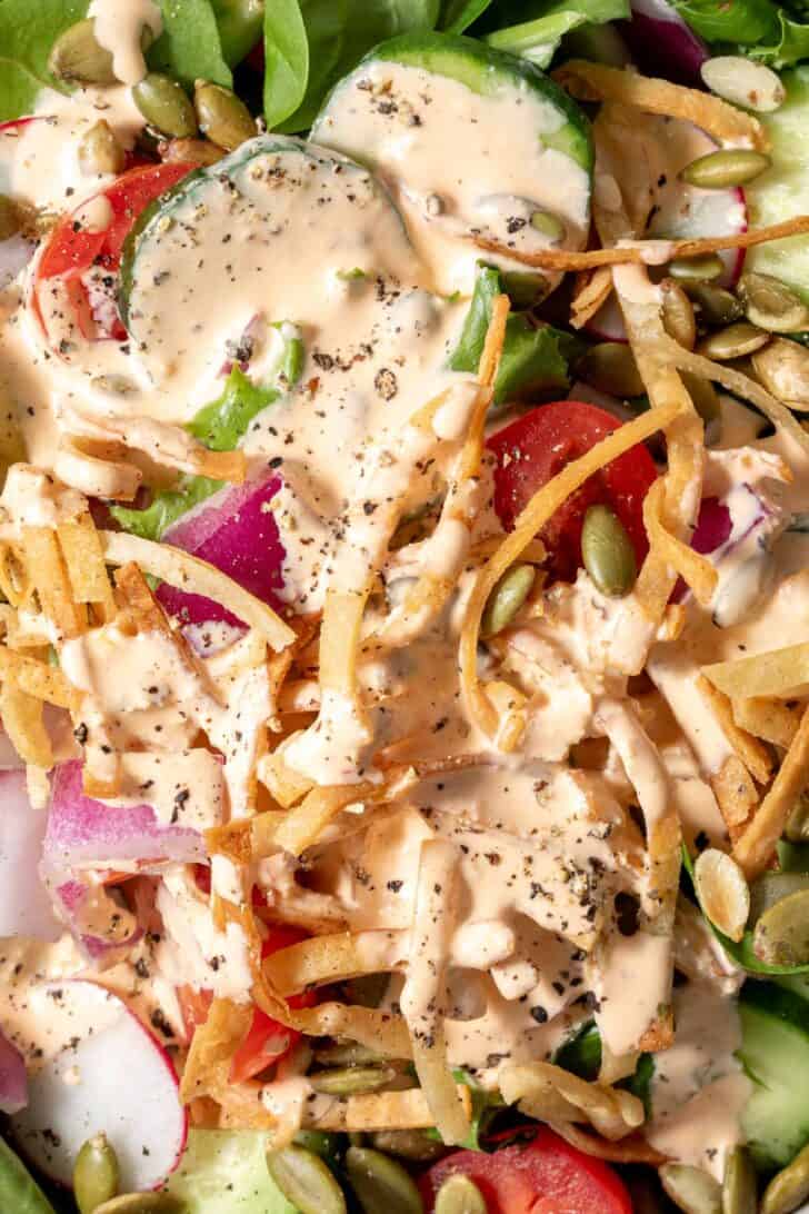 Mixed greens tossed with cucumbers, tomatoes, radishes, onion, tortilla strips and pepitas.