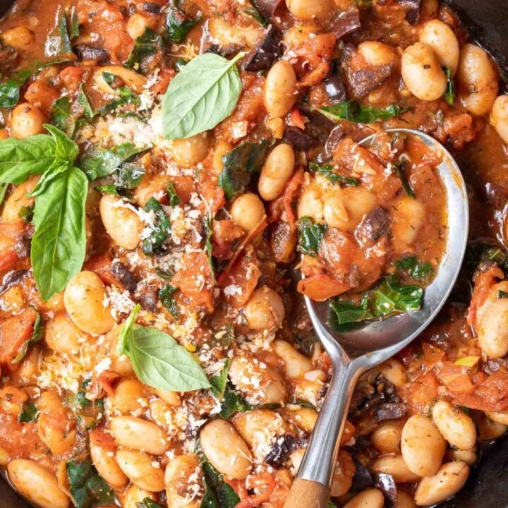 A cast iron skillet filled with Italian butter beans.