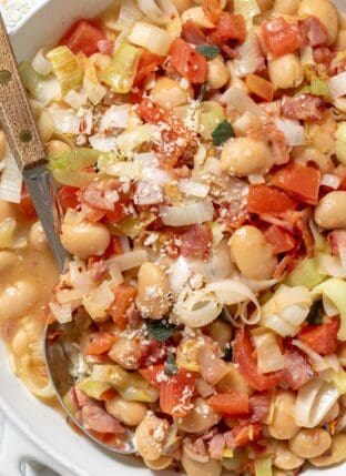 Butter Beans with Leeks in a white skillet.