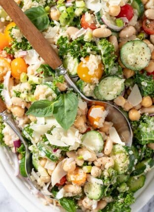 A white oval platter filled with White Bean Quinoa Salad.