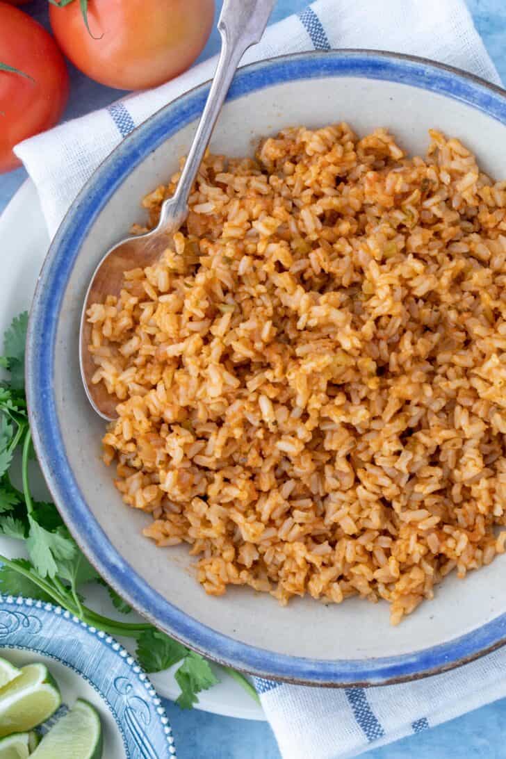A white bowl of cooked Mexican brown rice.
