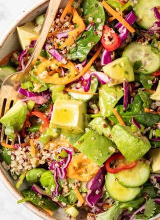 A bowl filled with Avocado Quinoa Salad.