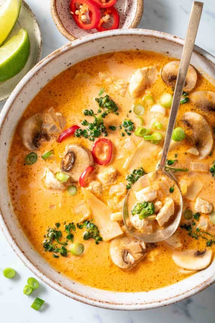 A bowl filled with Thai Coconut Chicken Soup.