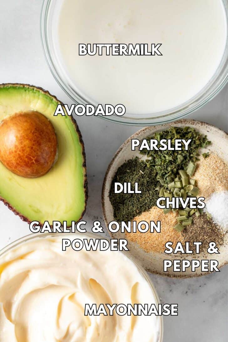 Class bowls filled with mayonnaise, buttermilk and spices.