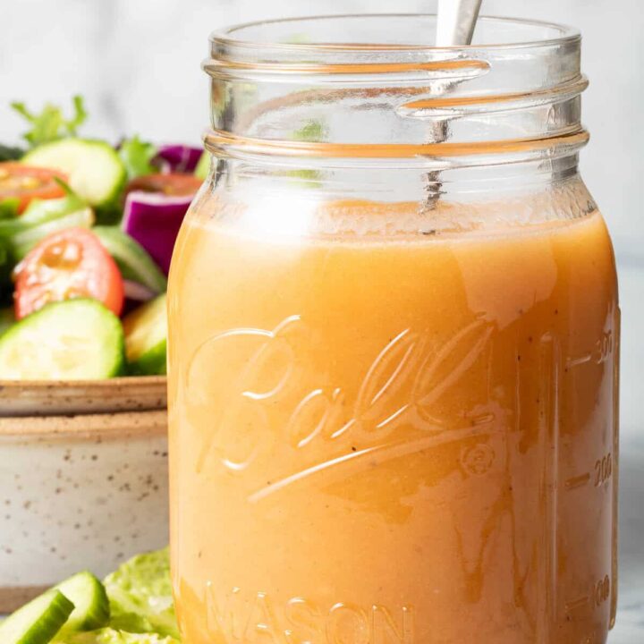 A clear mason jar filled with Chipotle Honey Vinaigrette.