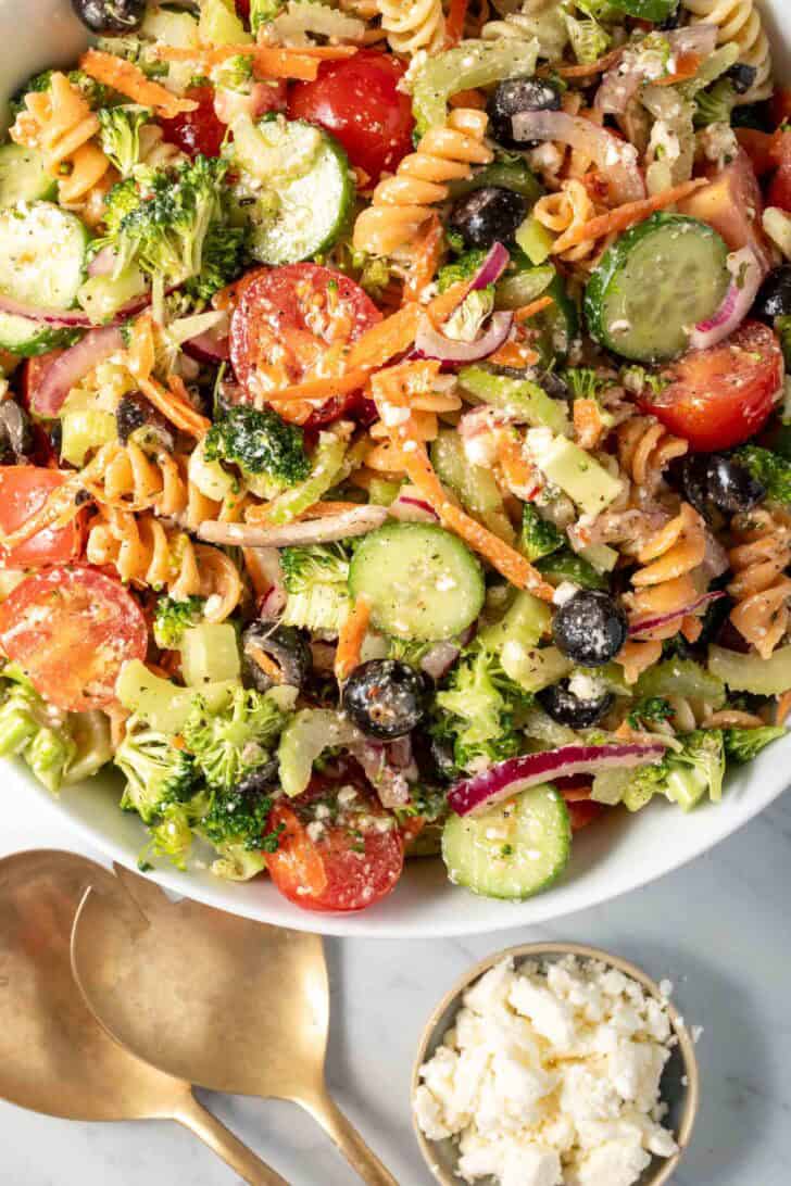 A white bowl filled with Summer Pasta Salad.