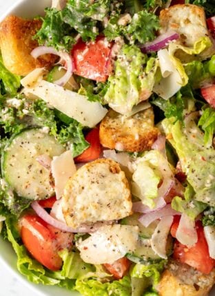 A white bowl filled with Simple Kale Salad.