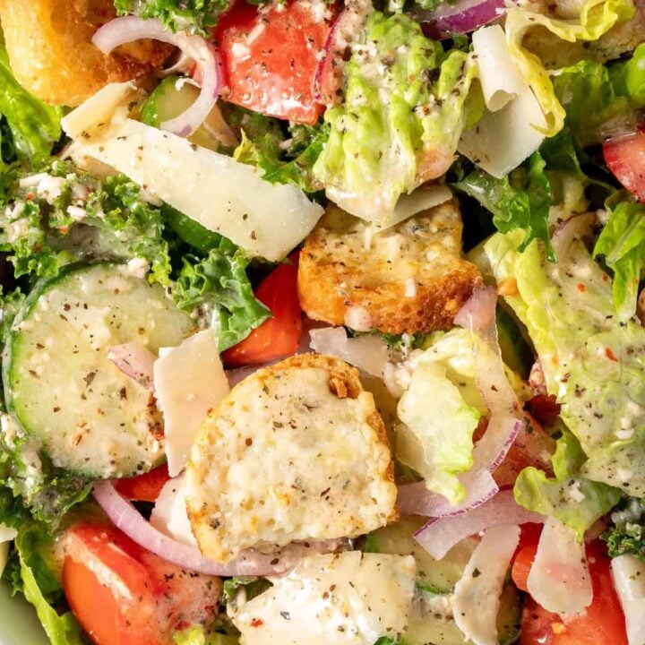 A white bowl filled with Simple Kale Salad.
