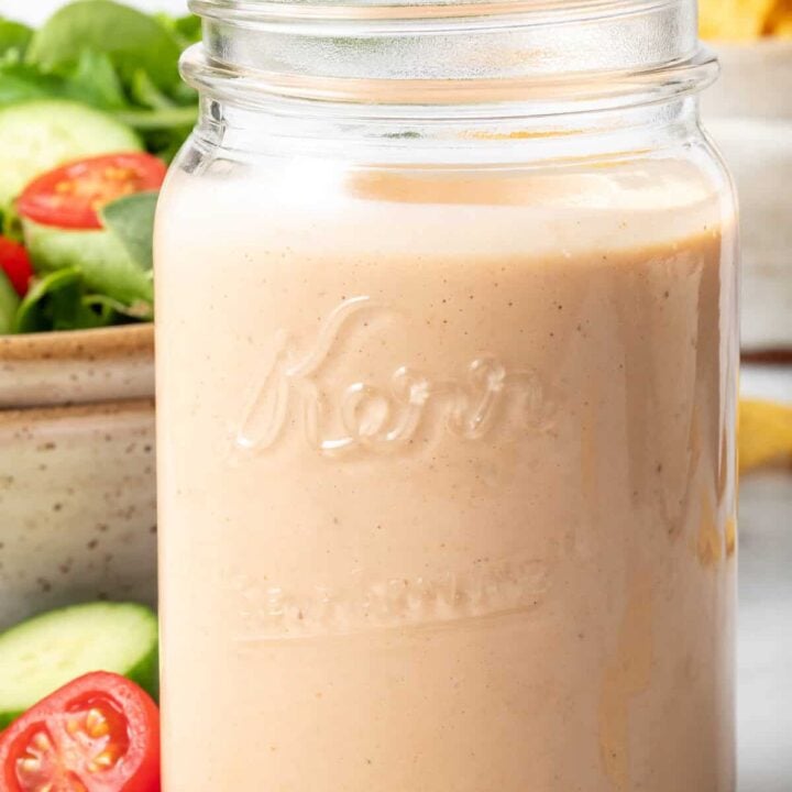 A clear mason jar filled with Southwest Ranch Dressing.