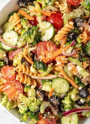A white bowl filled with Summer Pasta Salad.
