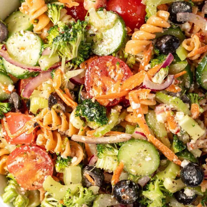 A white bowl filled with Summer Pasta Salad.