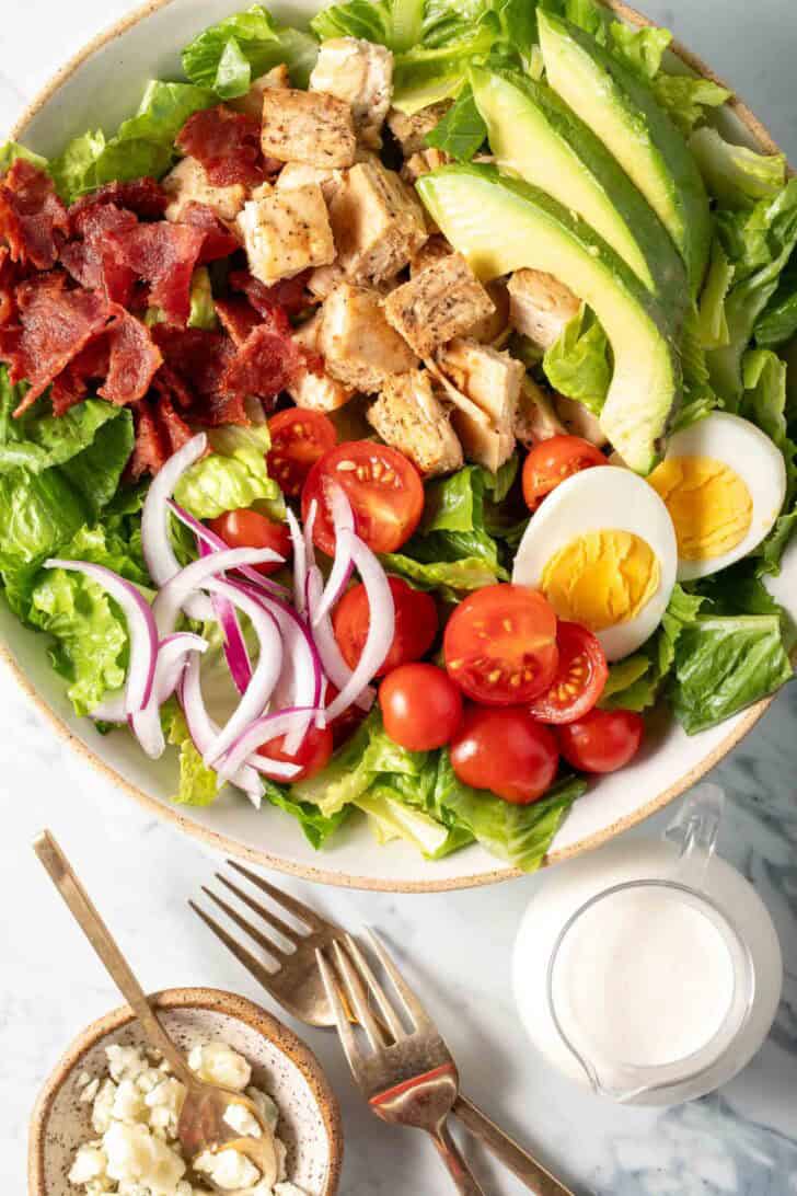 A bowl filled with Cobb Chicken Salad.