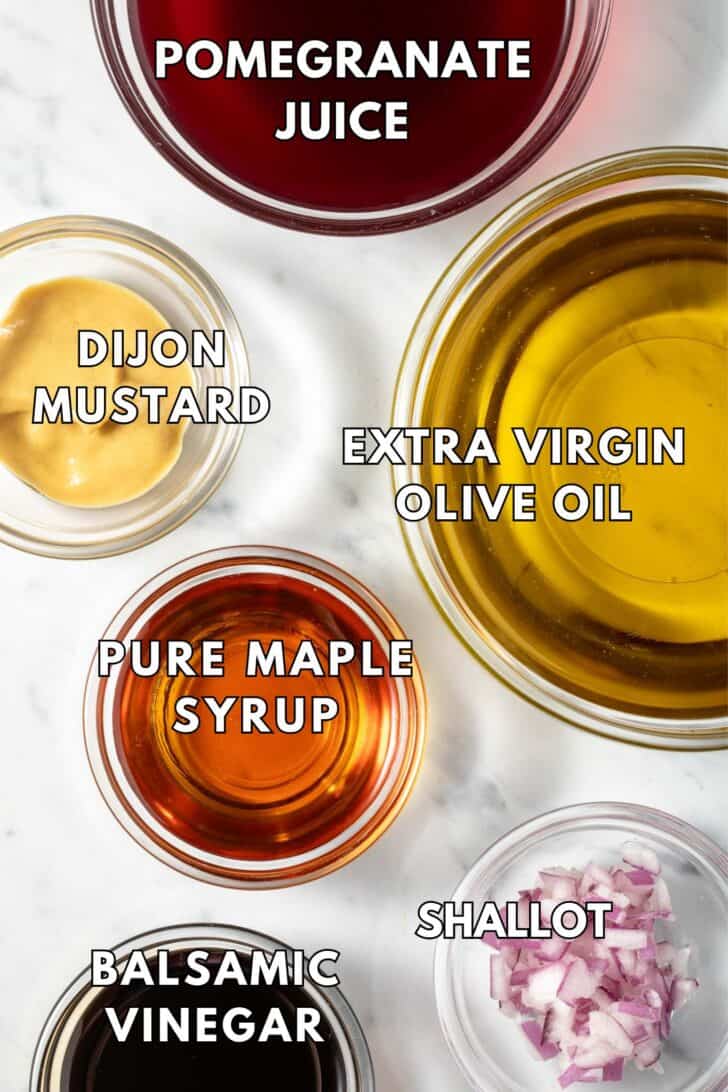 Clear glass bowls filled with olive oil, maple syrup, balsamic vinegar, juice and Dijon mustard.