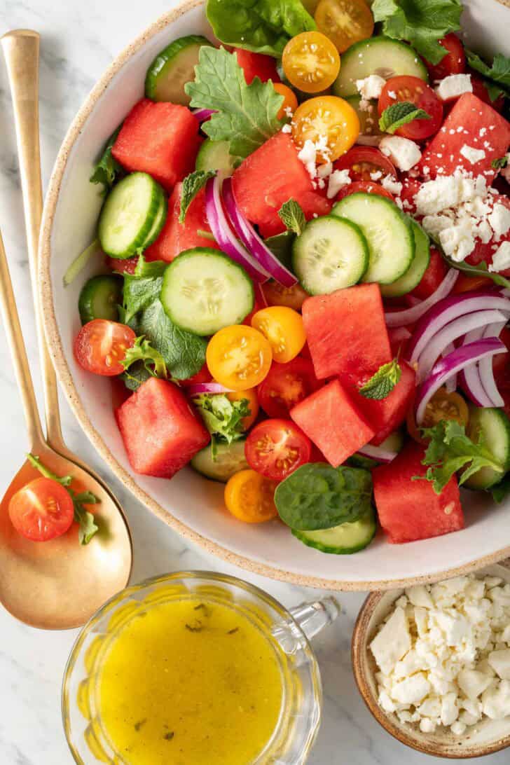A bowl filled with Watermelon Cucumber Salad with Feta.