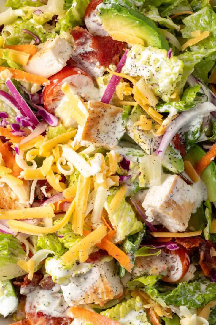 Chicken Bacon Ranch Salad tossed in a bowl.