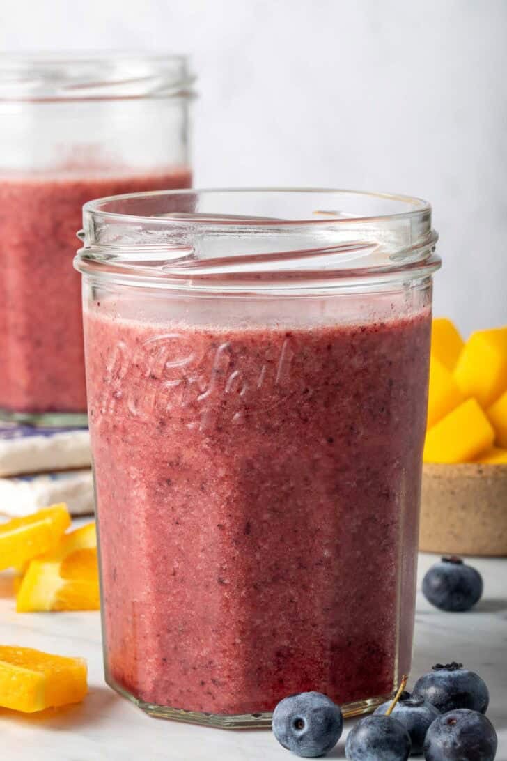 Blueberry Mango Smoothie in two glasses.