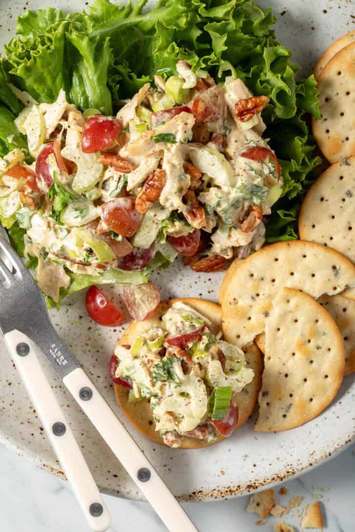 Curry Chicken Salad on a plate with crackers.