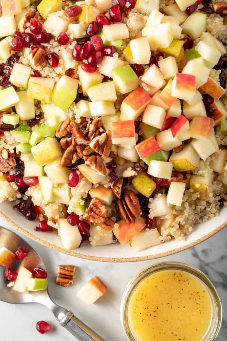 Fall Quinoa Salad with fruit in a bowl.
