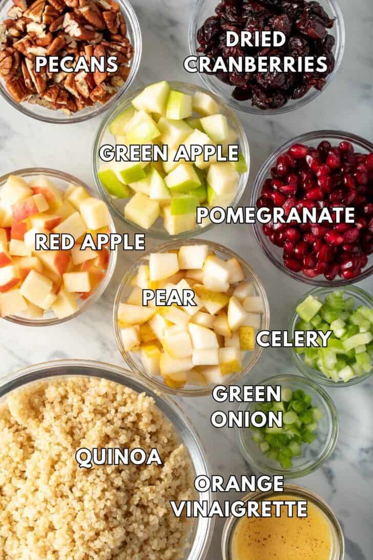 Clear glass bowls filled with fruit, nuts and grains.