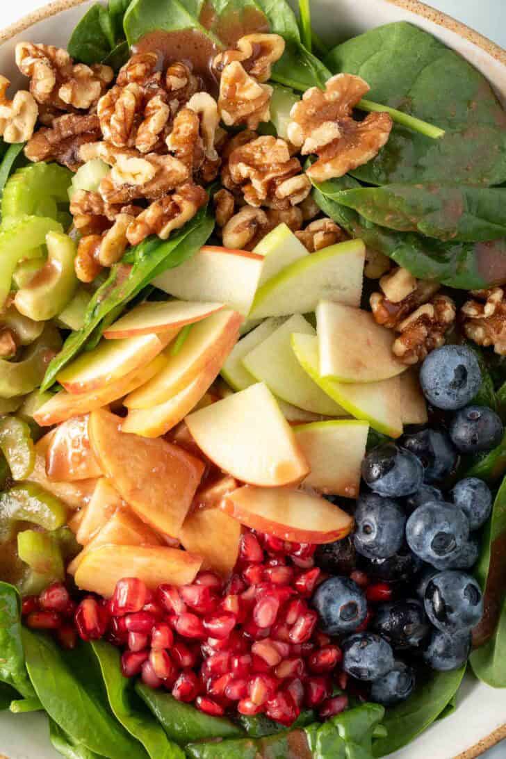 Spinach Apple Walnut Salad in a bowl.