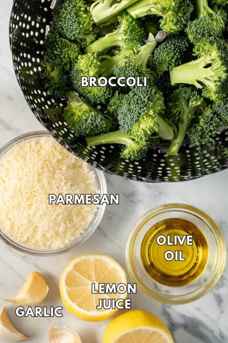 Raw broccoli in a steamer basket.