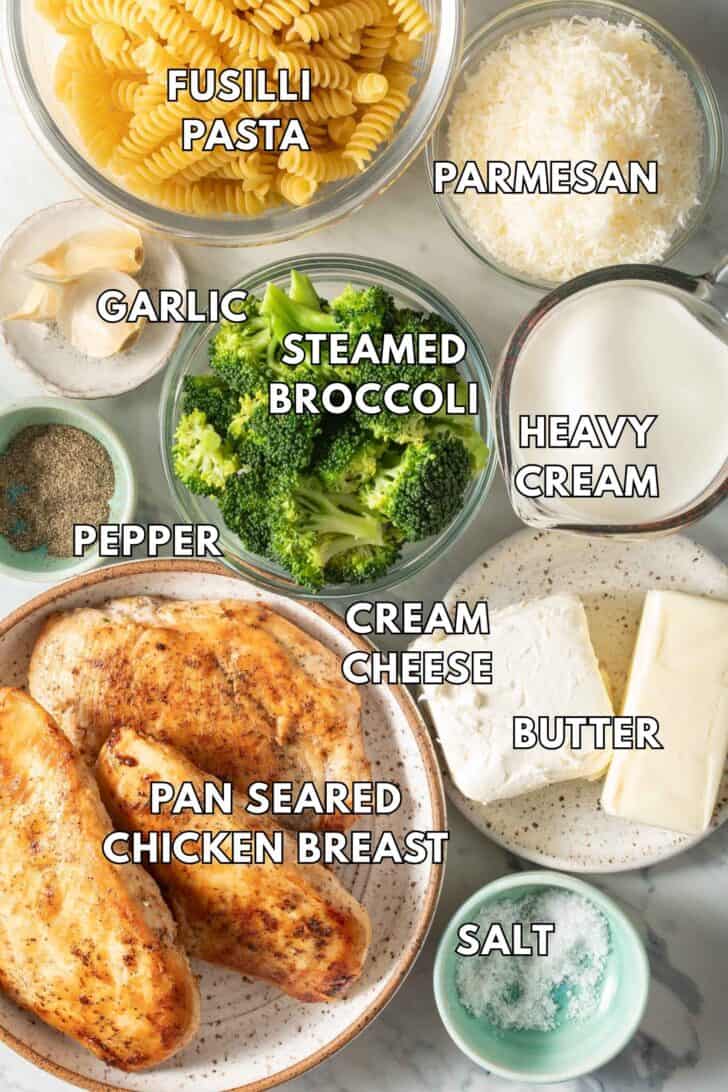 Chicken Broccoli Alfredo Recipe Clear glass bowls filled with pasta, steamed broccoli, pan seared chicken breast, Parmesan cheese and cream.