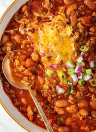 Easy Turkey Chili in a white bowl with a spoon.