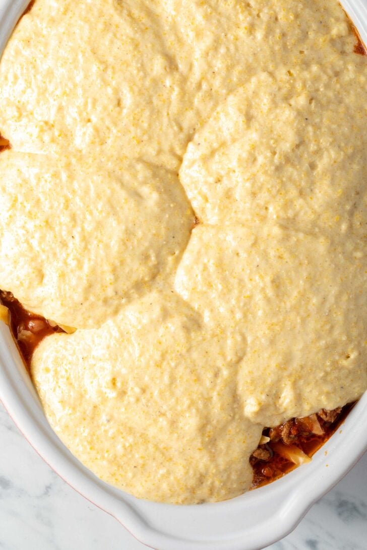 Cornbread Chili Casserole in a white baking dish.