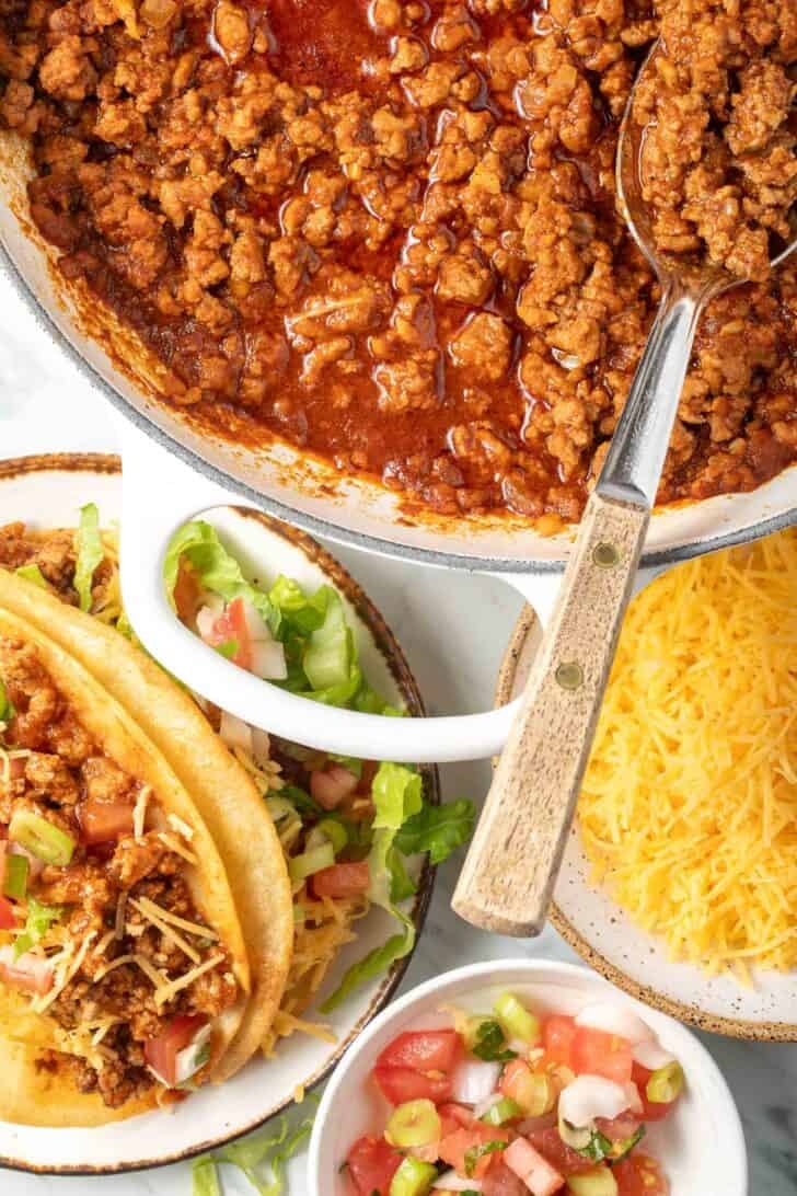 Ground turkey taco meat in a white skillet.