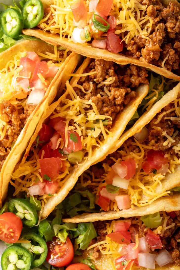 Hard Shell Tacos with Ground Turkey on a white plate.