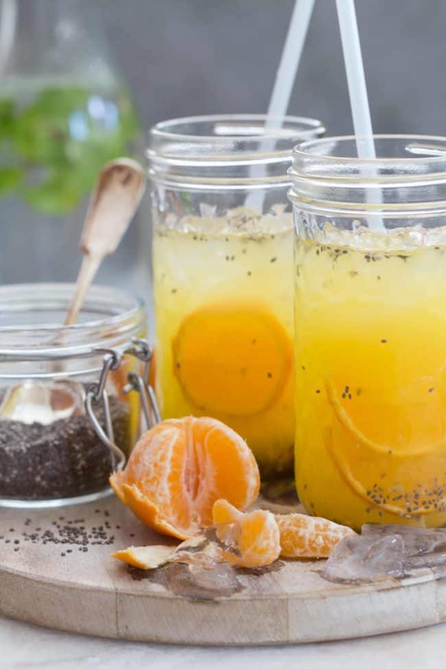 Two clear glasses filled with chia seed water.