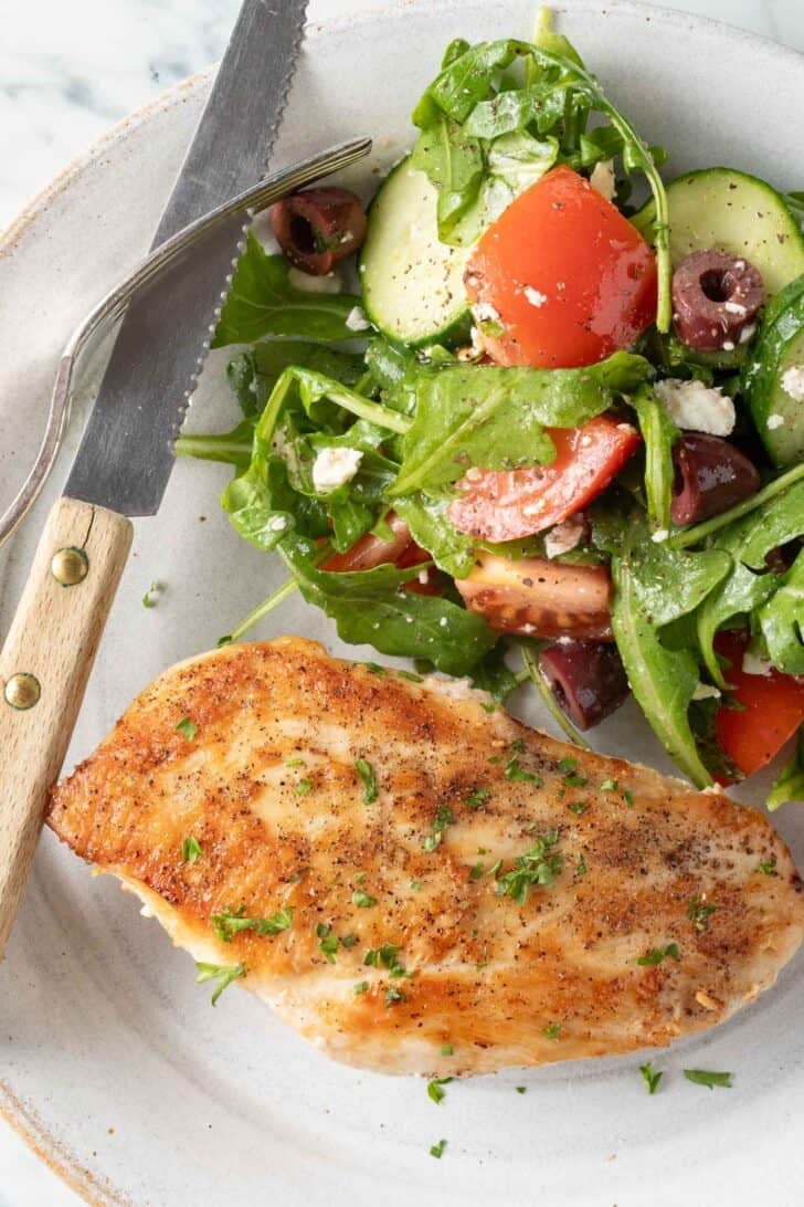 Pan Seared Chicken Breast Pan Seared Chicken Breast on a white plate.