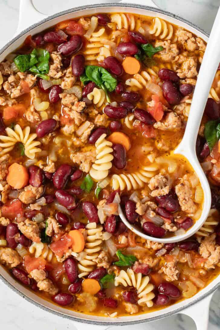 Italian Soup with Sausage Italian Soup with Sausage in a white pot.