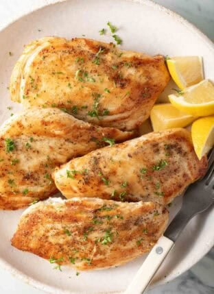 Pan Seared Chicken Breast on a white plate.