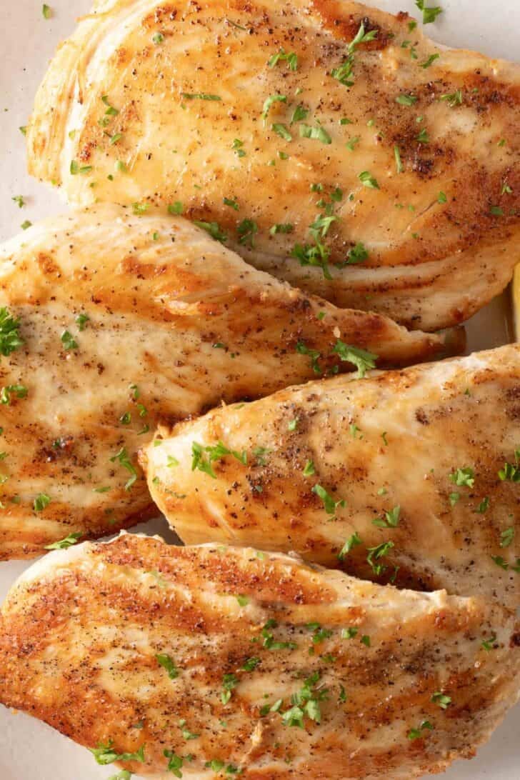 Pan Seared Chicken Pan Seared Chicken on a white plate.