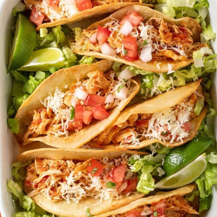 Shredded Chicken Tacos on a white tray.