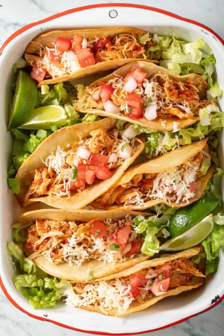 Shredded Chicken Tacos on a white tray.