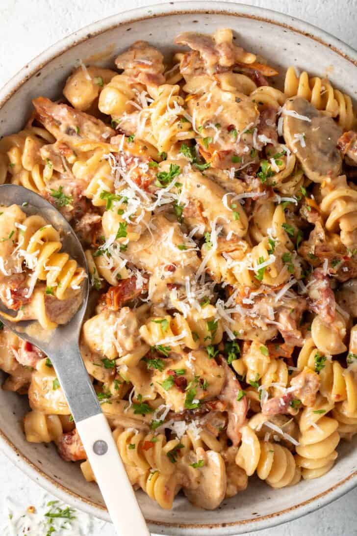 Easy Marry Me Chicken Pasta Easy Marry Me Chicken Pasta in a bowl with a spoon.