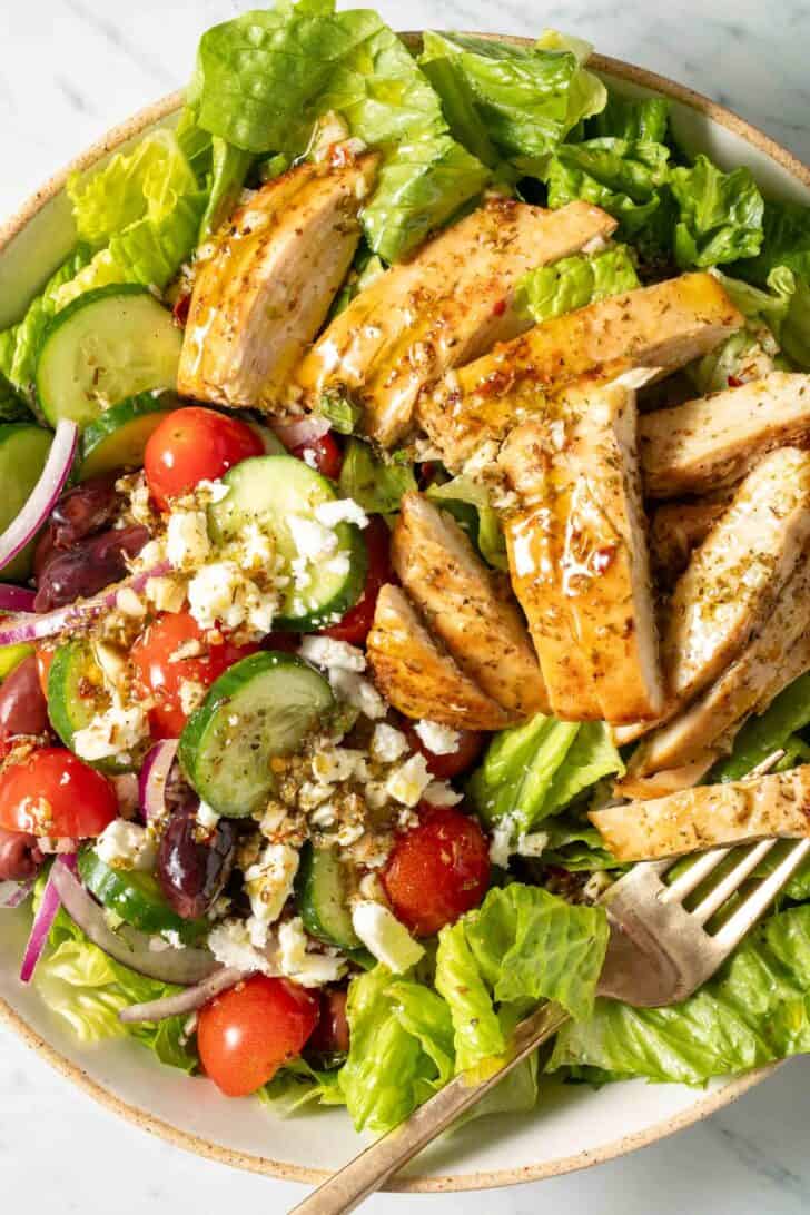 Greek Chopped Salad Greek Chopped Salad in a bowl with a fork.