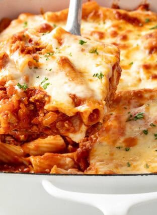 Baked Rigatoni with Ricotta in a white baking dish.