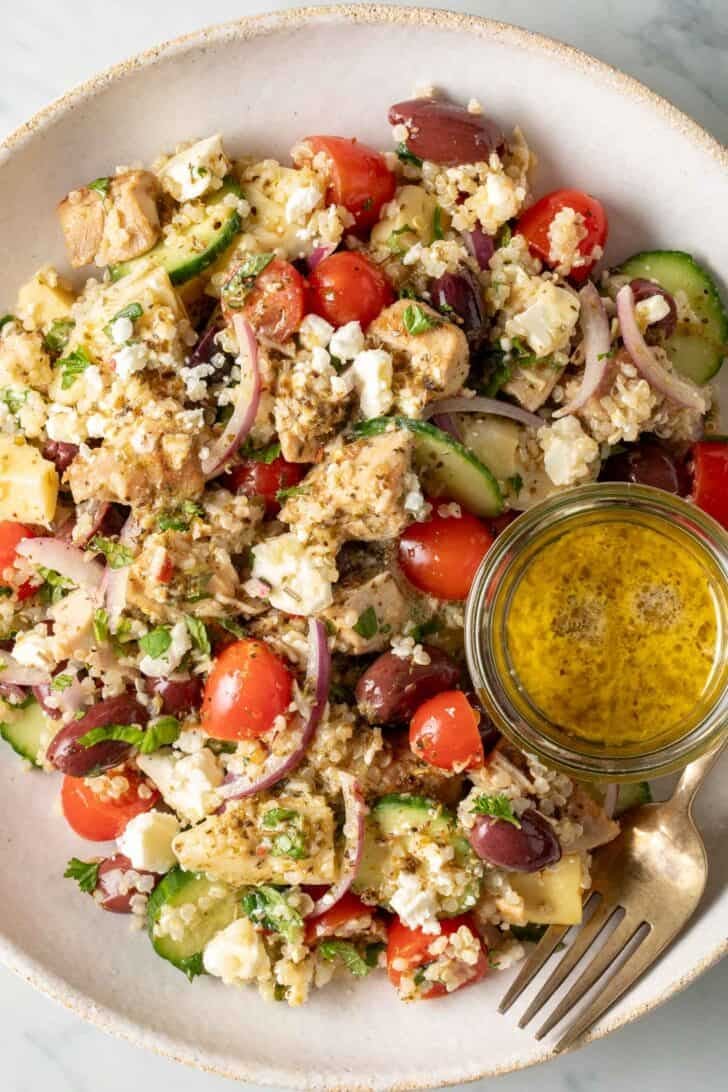Mediterranean Chicken Quinoa Salad Mediterranean Chicken Quinoa Salad in a white bowl.
